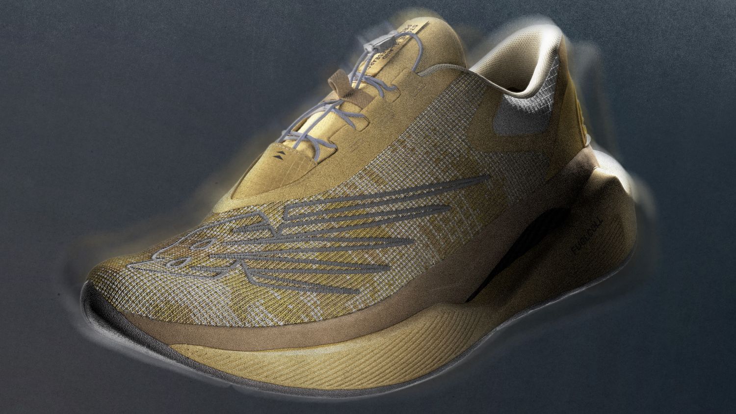 Side view of a tan and grey New Balance running shoe.